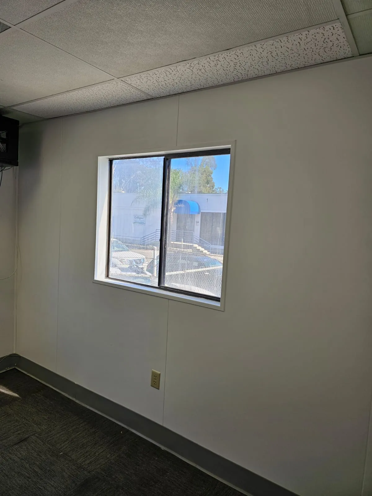 Finished drywall wall surrounding a commercial window