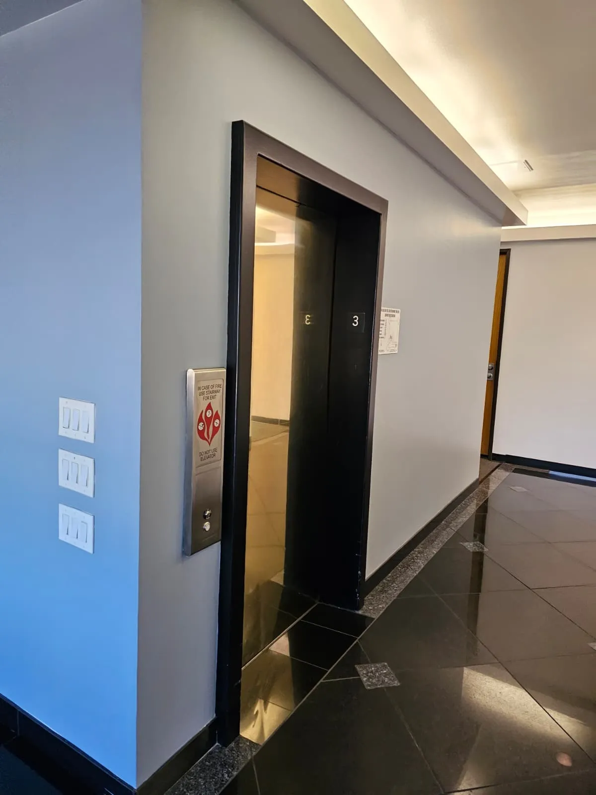 Finished commercial interior hallway and elevator surround